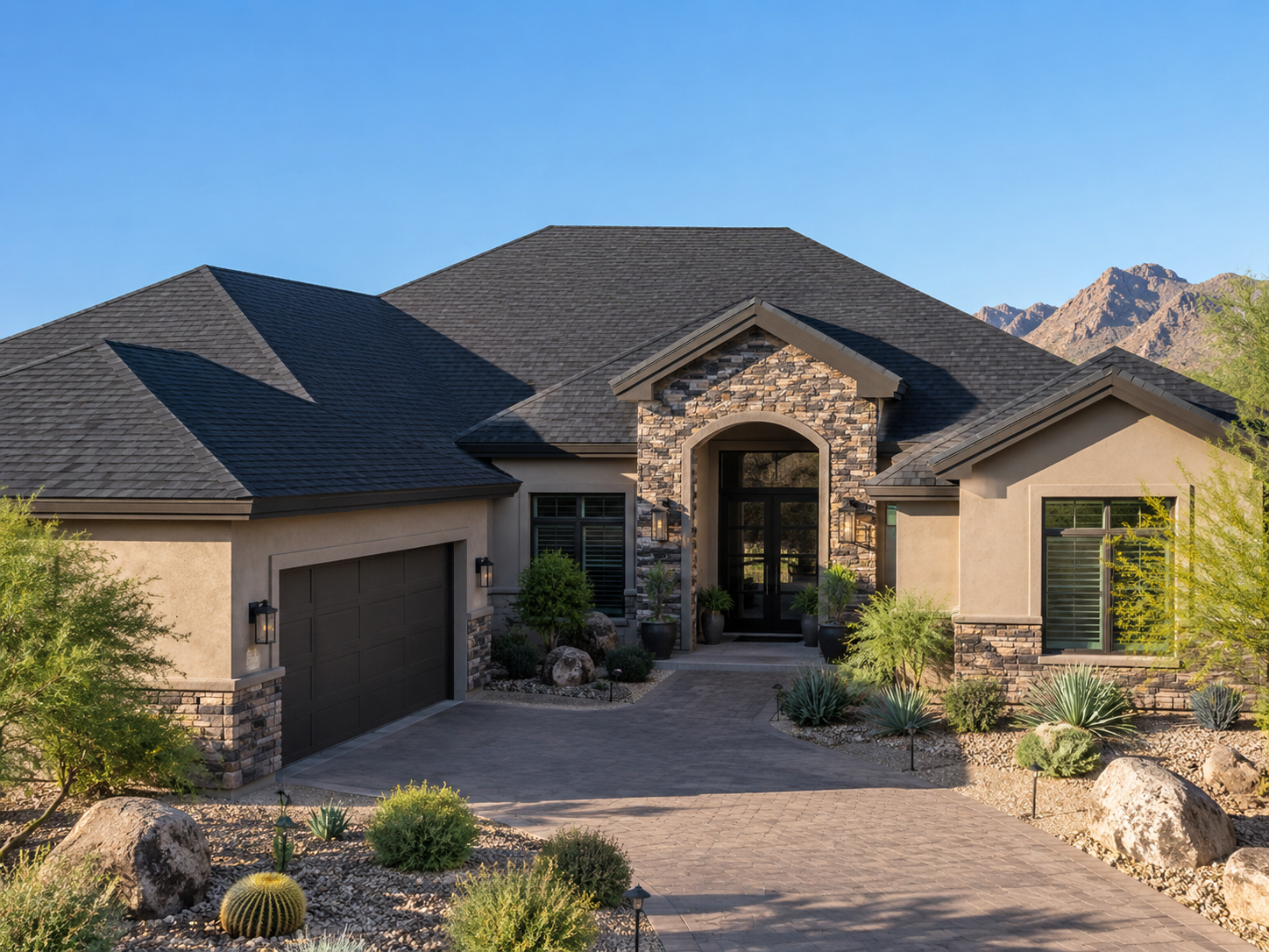 Custom Arizona home with a finished dark shingle roof